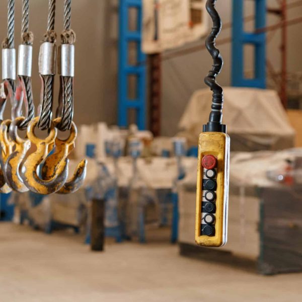 Movement remote control pendant switch for overhead crane in the factory.